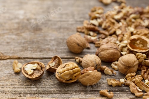 Preview: Walnut Kernels And Whole Walnuts On Rustic Old Wooden Table