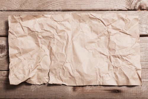 Preview: Crumpled Paper On Wooden Background