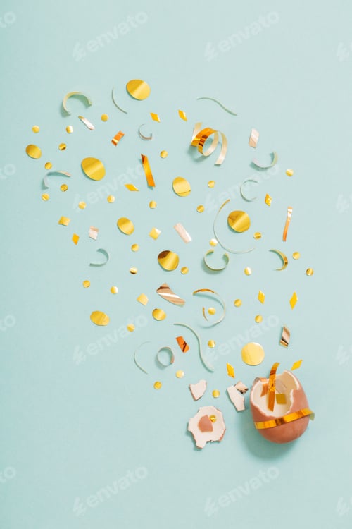 Preview: Easter Chocolate Egg With Golden Confetti On Blue Mint Paper Background