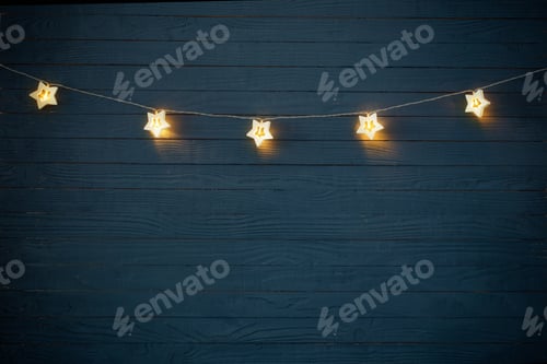 Preview: Christmas Lights On Blue Wooden Background