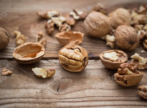 Preview: Walnut Kernels And Whole Walnuts On Rustic Old Wooden Table
