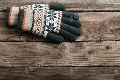 Preview: Winter Gloves On Wooden Background