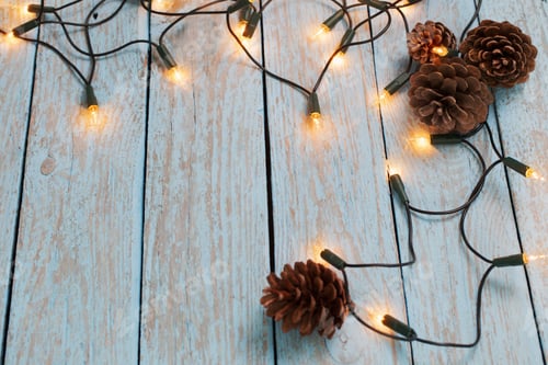 Preview: Christmas Lights On Blue Wooden Background