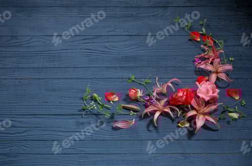 Preview: Beautiful Summer Flowers On Dark Blue Wooden Background
