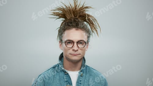 Preview: Portrait Of Happy Man Posing On Grey Background. Closeup Stylish Guy Laughing At Camera In Slow