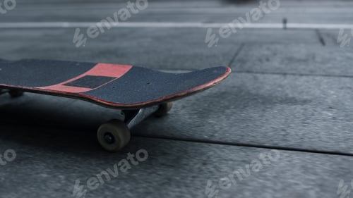 Preview: Closeup Skateboard Riding Outdoor. Skate Board With White Wheels Rolling Outside. Black And Red
