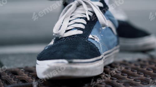 Preview: Closeup Sporty Shoes Staying Outdoor. Man Feet In Trendy Sneakers For Sports. Casual Male Boots