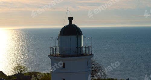 Preview: Drone View Sea Lighthouse At Morning Sunrise. Closeup Nautical Beacon At Cloud Sky Sunset. Seashore