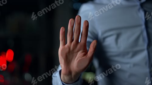 Preview: Macro Of Man Handprinting On Glass Wall Indoors. Male Person Wearing Blue Shirt On Background