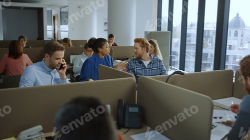 Preview: Redhead Businessman And Afro Businesswoman Discussing Corporate Plan At Workplace. Business People