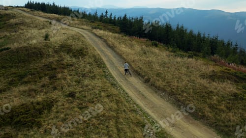Preview: Man With Bike Mountain View Doing Active Sport Hilly Road Woods Background. Charming Scene Young