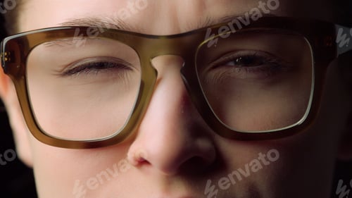 Preview: Portrait Of Focused Young Woman Closing Eyes In Glasses In Office. Serious Beautiful Student Girl