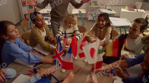 Preview: Crane Shot Of Multi Ethnic Children Holding International Flags In Hands At School. Smiling