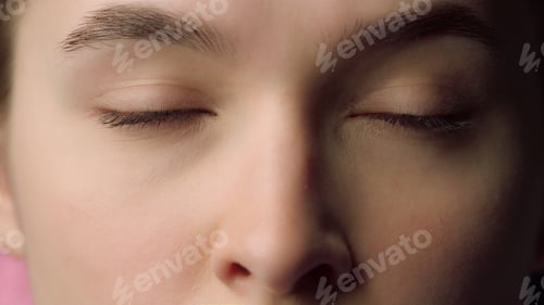 Preview: Closeup Face Portrait Of Beautiful Young Woman. Serious Female Eyes Looking Right And Left In