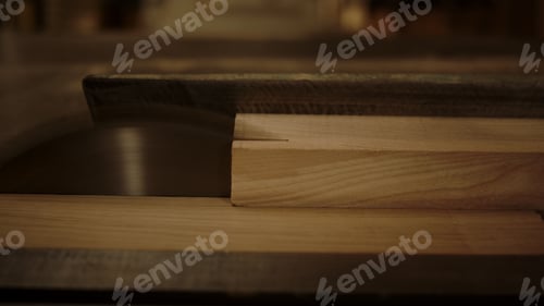 Preview: Closeup Unknown Guy Working With Saw Machine In Carpentry Workshop. Man Preparing Plank For Product
