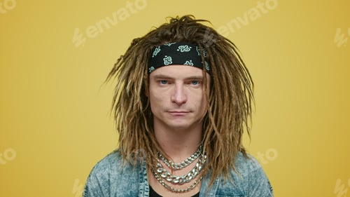 Preview: Serious Guy In Headband Standing In Studio. Portrait Of Handsome Man Smiling At Camera. Brutal