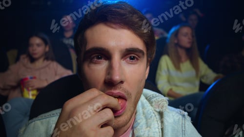 Preview: Portrait Of Smiling Man Looking Comedy Indoor. Closeup Happy Guy Laughing In Movie Theater