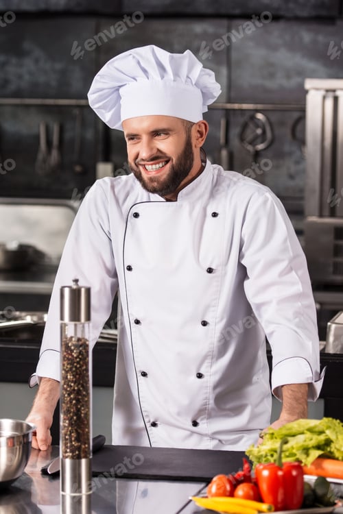 Preview: Chef Man At Kitchen Restaurant. Portrait Of Smiling Male Cooker In Uniform. Happy Man Cook Healthy