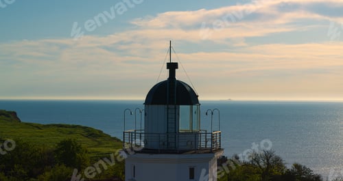 Preview: Aerial View Seashore Lighthouse At Sea Sunrise Morning. Sea Coastline With Nautical Beacon At Cloud