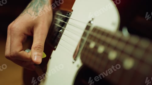 Preview: Unrecognizable Guitarist Playing Rock In Repetition Hall. Man Fingers Holding Mediator In Recording