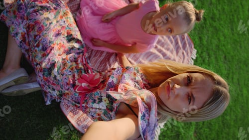 Preview: Cheerful Mother And Daughter Fooling In Park. Happy Woman And Girl Grimacing For Mobile Phone