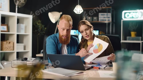 Preview: Closeup Man And Woman Presenting Project On Video Call In Dark Office. Young Business Couple