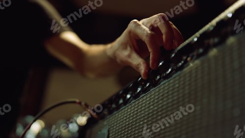 Preview: Unknown Sound Engineer Preparing Equipment For Concert In Dark Hall. Man Hand Turning Knobs On