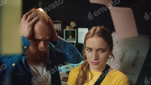 Preview: Upset Business Couple Finding Mistakes On Idea Board In Office. Stressed Hipster People Looking
