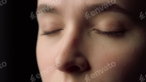 Preview: Macro Of Female Face Beauty Resting With Closed Eyes In Studio. Tired Young Woman Looking At Screen