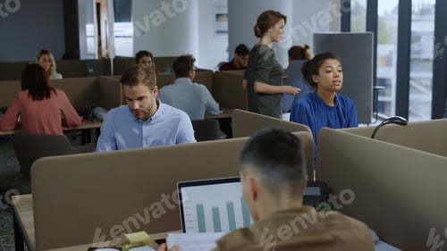 Preview: Confident Businessman Working With Financial Documents At Office Workplace. Mixed Race Business