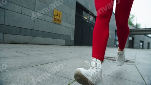 Preview: Woman Legs Running On Street In Slow Motion. Close Up Female Runner Legs Jogging On Urban Street