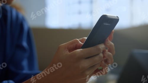 Preview: African American Businesswoman Texting Message On Smartphone At Office Workplace. Closeup Focused