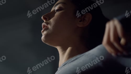 Preview: Focused Woman Preparing For Physical Exercises In Gym. Portrait Of Female Athlete Warming Shoulders