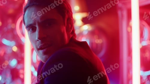 Preview: Portrait Of Handsome Person Doing Hip Hop Elements On Neon Lights Background. Closeup Attractive