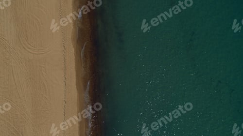 Preview: Nature Background Of Sandy Beach View With Smooth Ocean Surface In Warm Summer Morning. Meditative