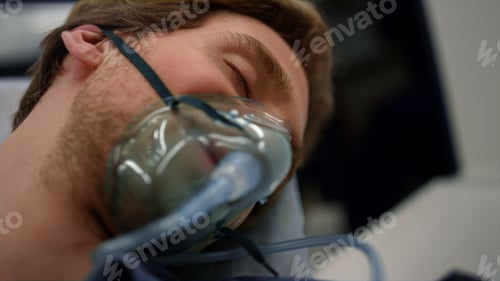 Preview: Unconscious Man Breathing In Oxygen Mask. Male Patient Lying On Stretchers. Sick Guy With