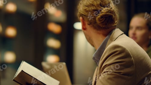 Preview: Handsome Businessman Looking At Planner Book In Conference Room Of Coworking Space. Closeup