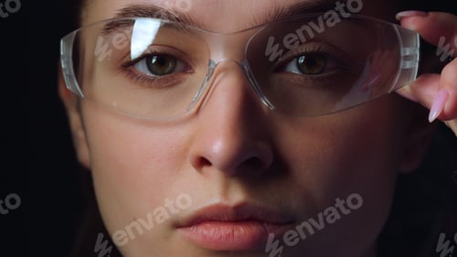 Preview: Serious Businesswoman Wearing Virtual Reality Glasses In Office. Closeup Of Focused Young Woman