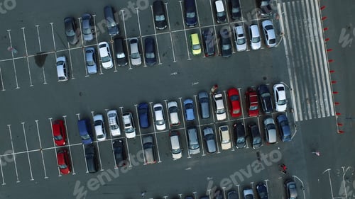 Preview: Copter Filming People Walking At Car Parking Lot. Drone Footage Modern Car Riding At Mall Parking