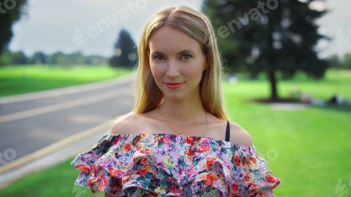 Preview: Young Woman Looking To Camera In City Park. Beautiful Female Person Enjoying Family Weekend