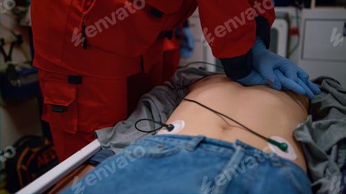 Preview: Paramedic Hands Performing Cpr Of Injured Man On Stretchers In Emergency Car. Medical Assistant In