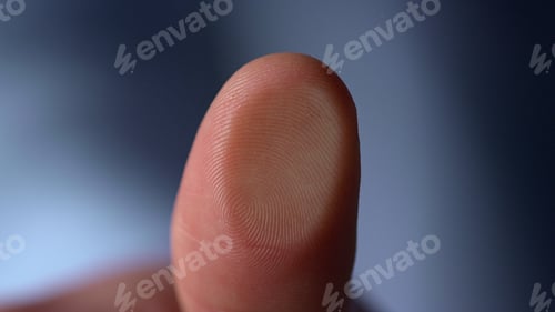 Preview: Marco Video Of Fingerprint On Glass Surface Indoors. Male Finger Pressing Glassware On Blue