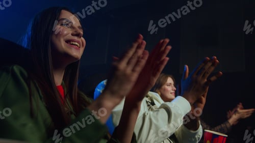 Preview: Joyful Multicultural People Having Fun In Cinema. Cheerful Friends Applauding In Movie Theater