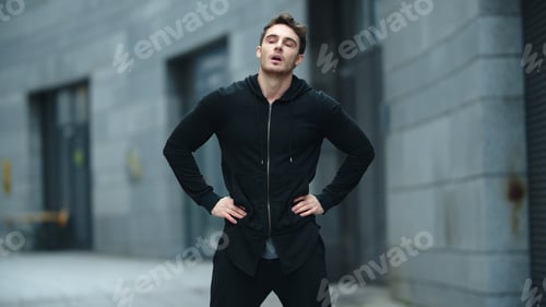 Preview: Fit Man Warming Up Outdoor In Slow Motion. Sporty Man Stretching Neck On Street Training. Male