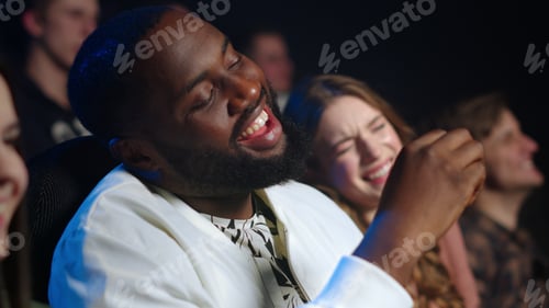 Preview: Closeup Afro American Man Laughing In Cinema. Joyful People Having Fun In Movie Theater. Cheerful