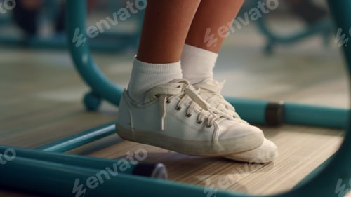 Preview: Closeup African American Girl Moving Legs. Female Student Feet Under School Desk In Classroom. Afro