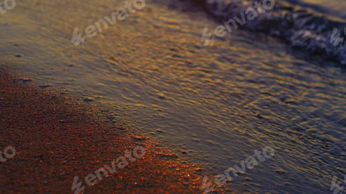 Preview: Closeup Calm Sea Waves Reflecting Bright Golden Sunset At Evening Dusk. Close Up Water Waves