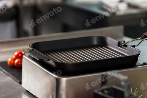Preview: Iron Griddle Pan With Vegetables. Closeup Griddle At Kitchen Restaurant. Texture Pan At