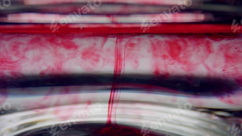 Preview: Closeup Test Tube With Blood Sample. Clear Liquid Mixing With Red Chemical Reagent. Macro Of Blood