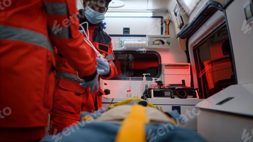 Preview: Professional Paramedics Rescuing Patient After Car Accident. Medical Workers Moving Injured Man On